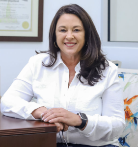Mimi Doucet, GMFS Mortgage loan officer in Lafayette, posing in professional attire.