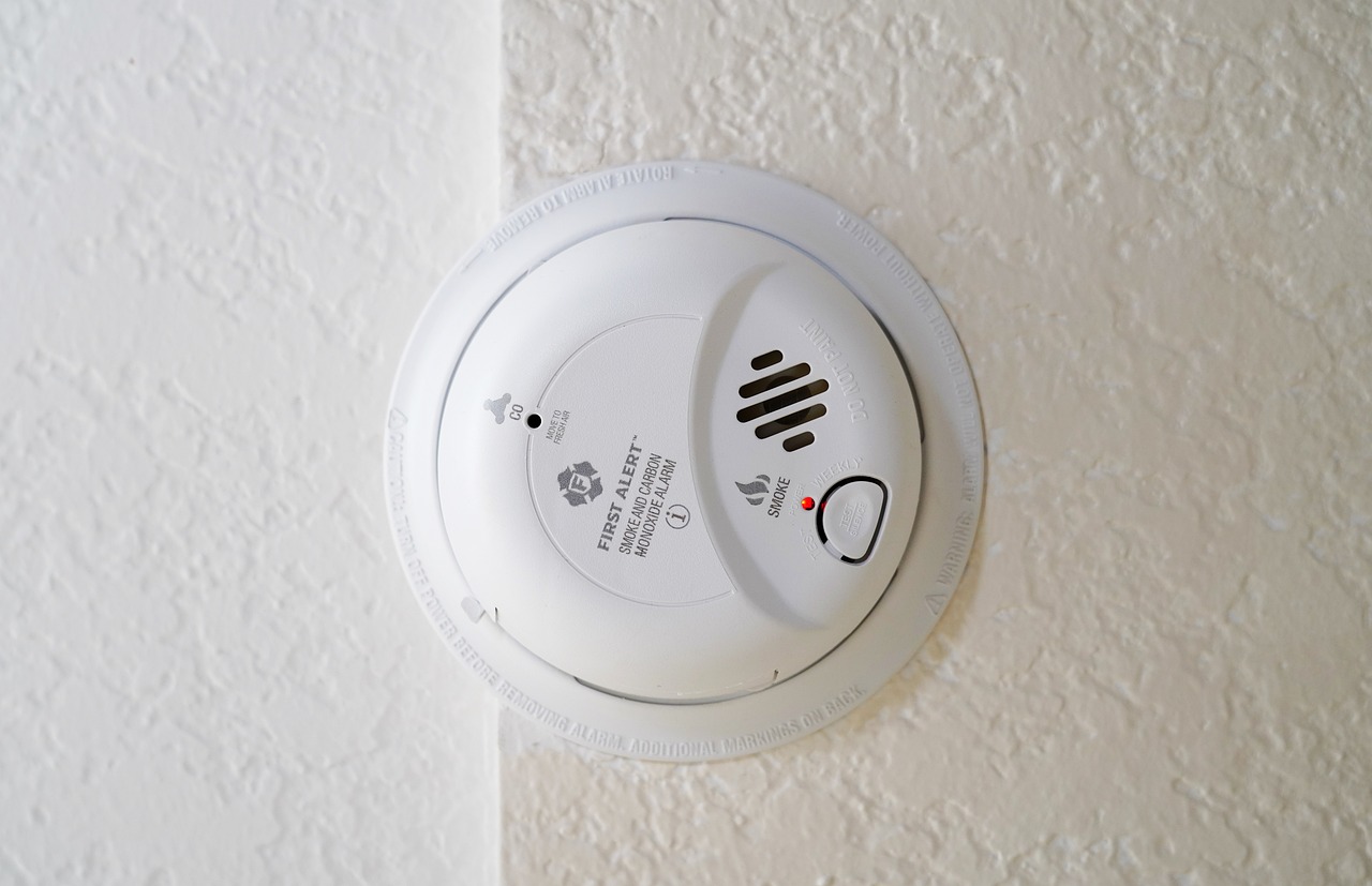 carbon monoxide detector mounted on a white wall
