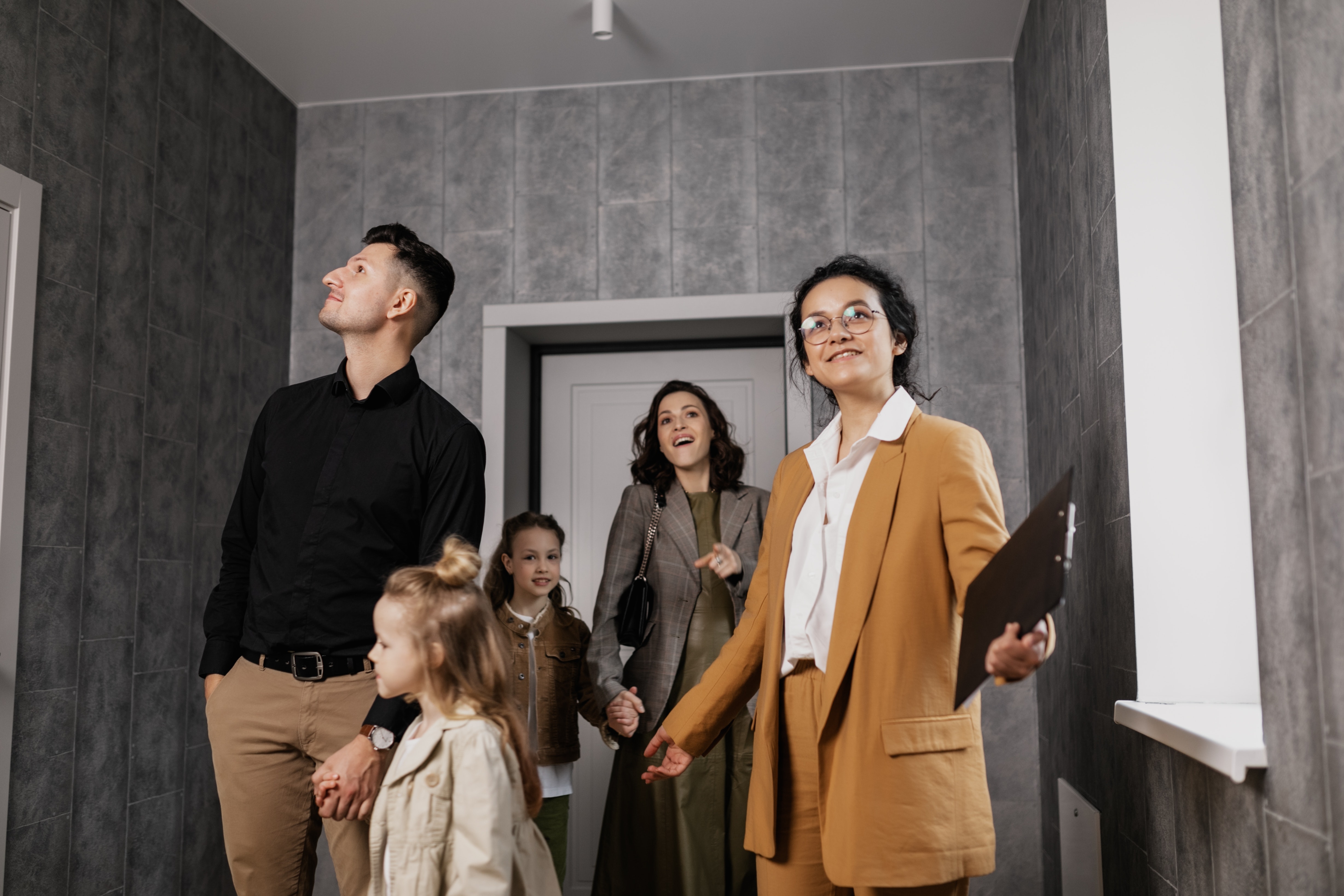 A young family tours a new home purchased with the help of a loan officer from GMFS Mortgage
