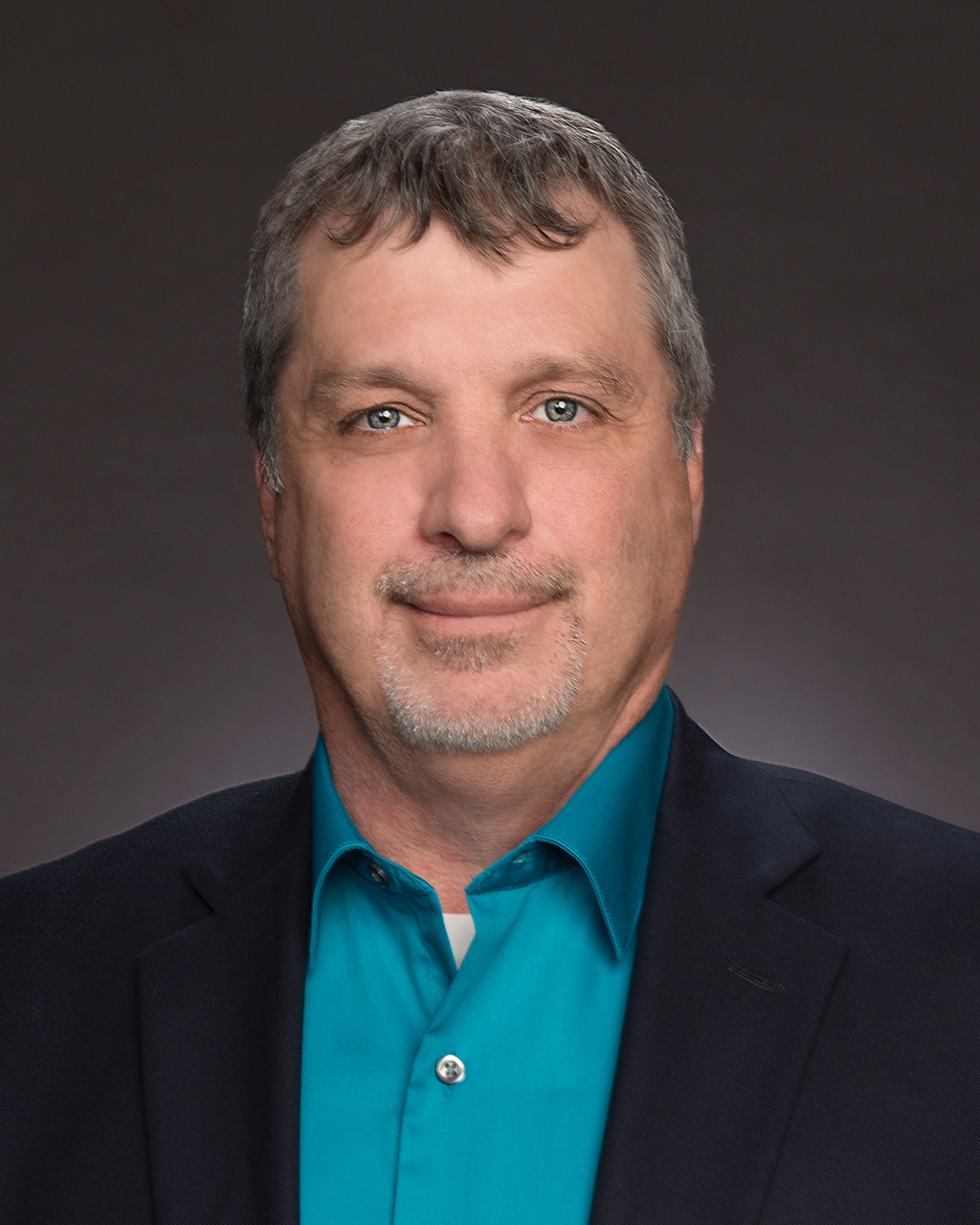 Professional headshot photo of Darren Gill