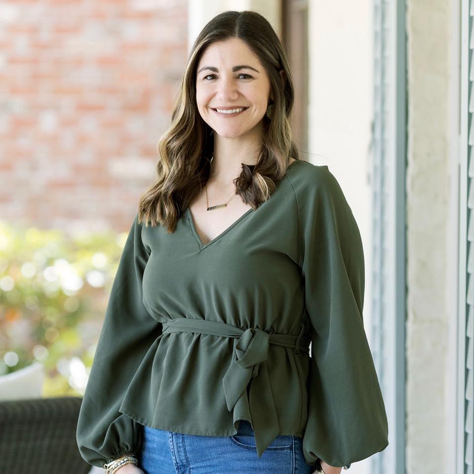 Candi Viator, mortgage loan officer, smiling in green blouse