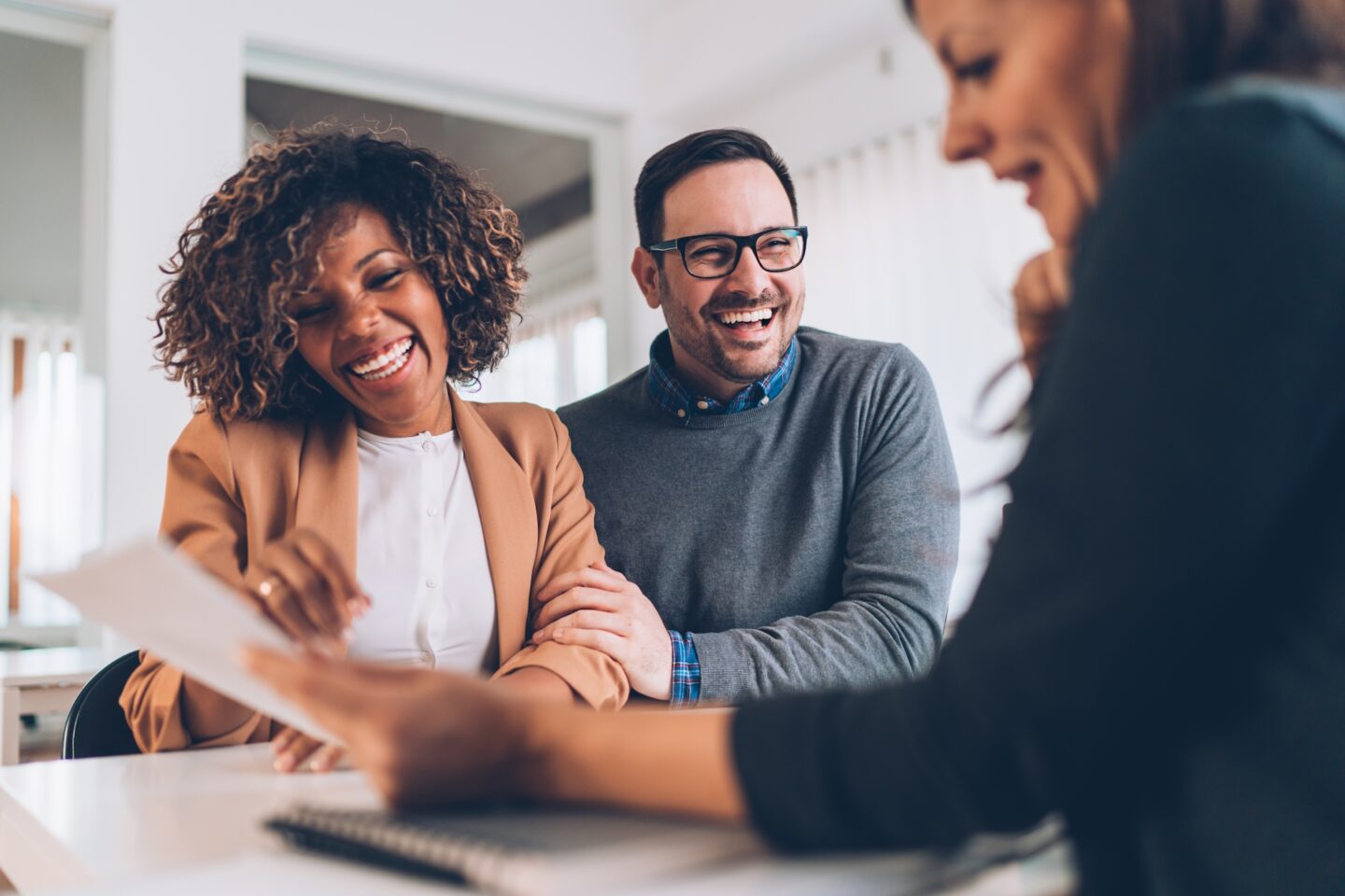 Couple happy and meeting with mortgage lender