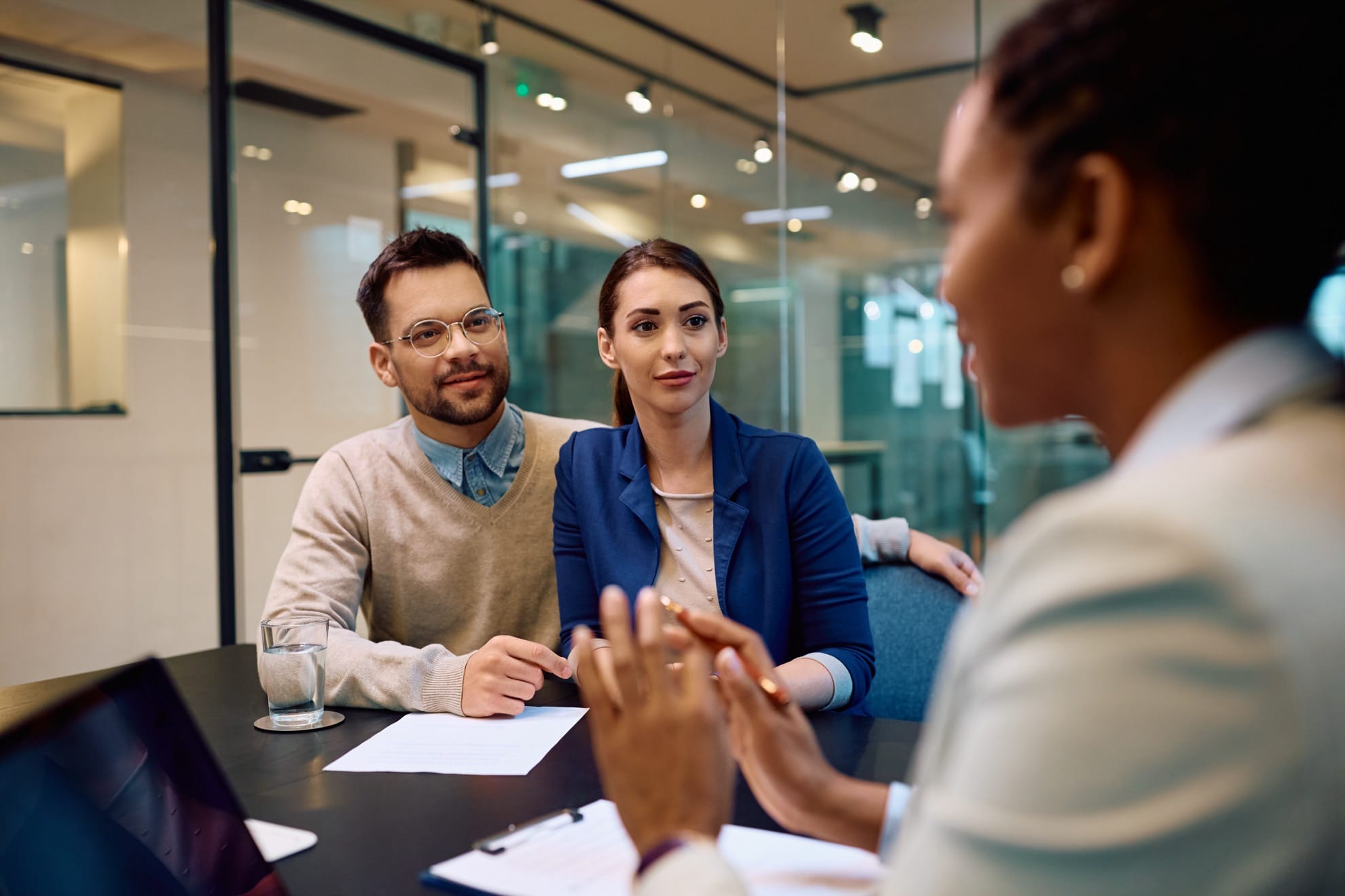 young couple meeting with mortgage lender
