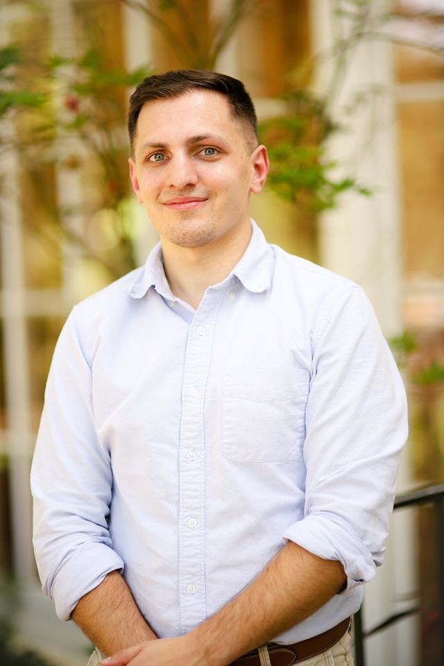 Chris Savage, Mortgage Loan Officer, smiling in light blue button down.
