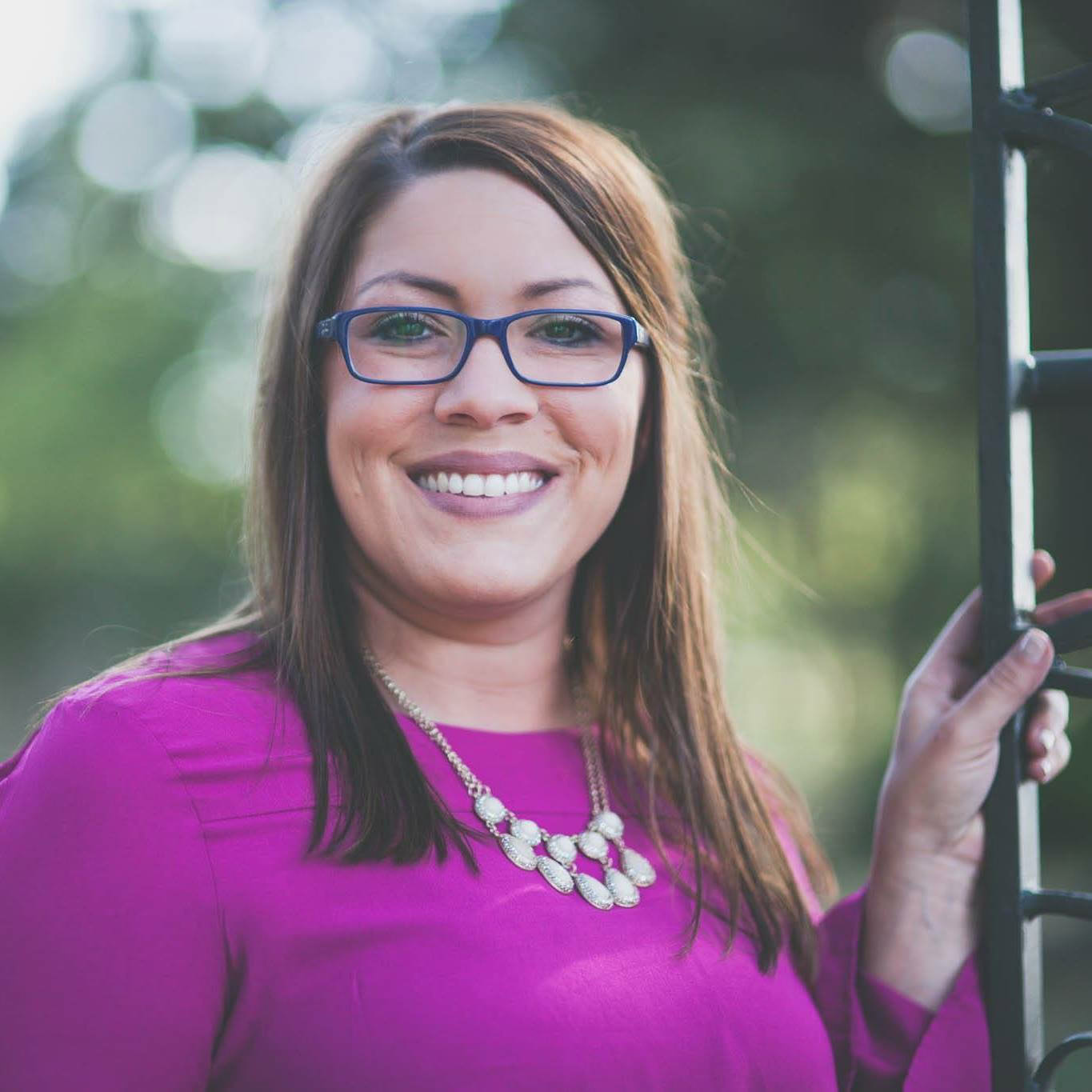 Frannie Lavergne, Mortgage Loan Officer, smiling in pink blouse.