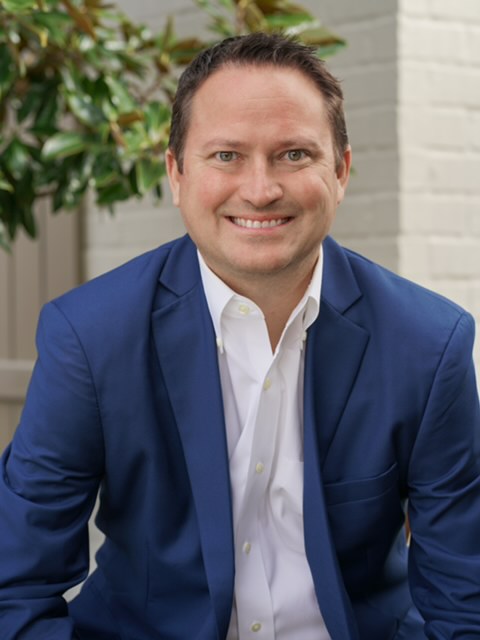Jason Vick, mortgage loan officer, in dark blue blazer
