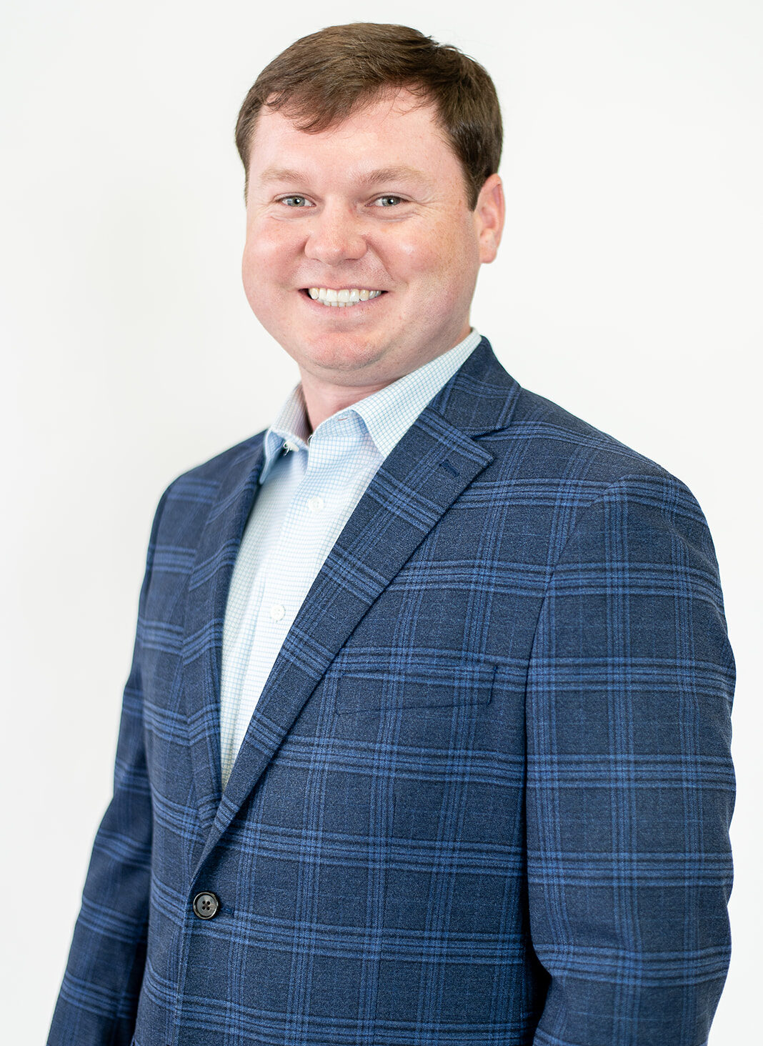 Josh Foster, Mortgage Loan Officer, smiling in blue blazer.
