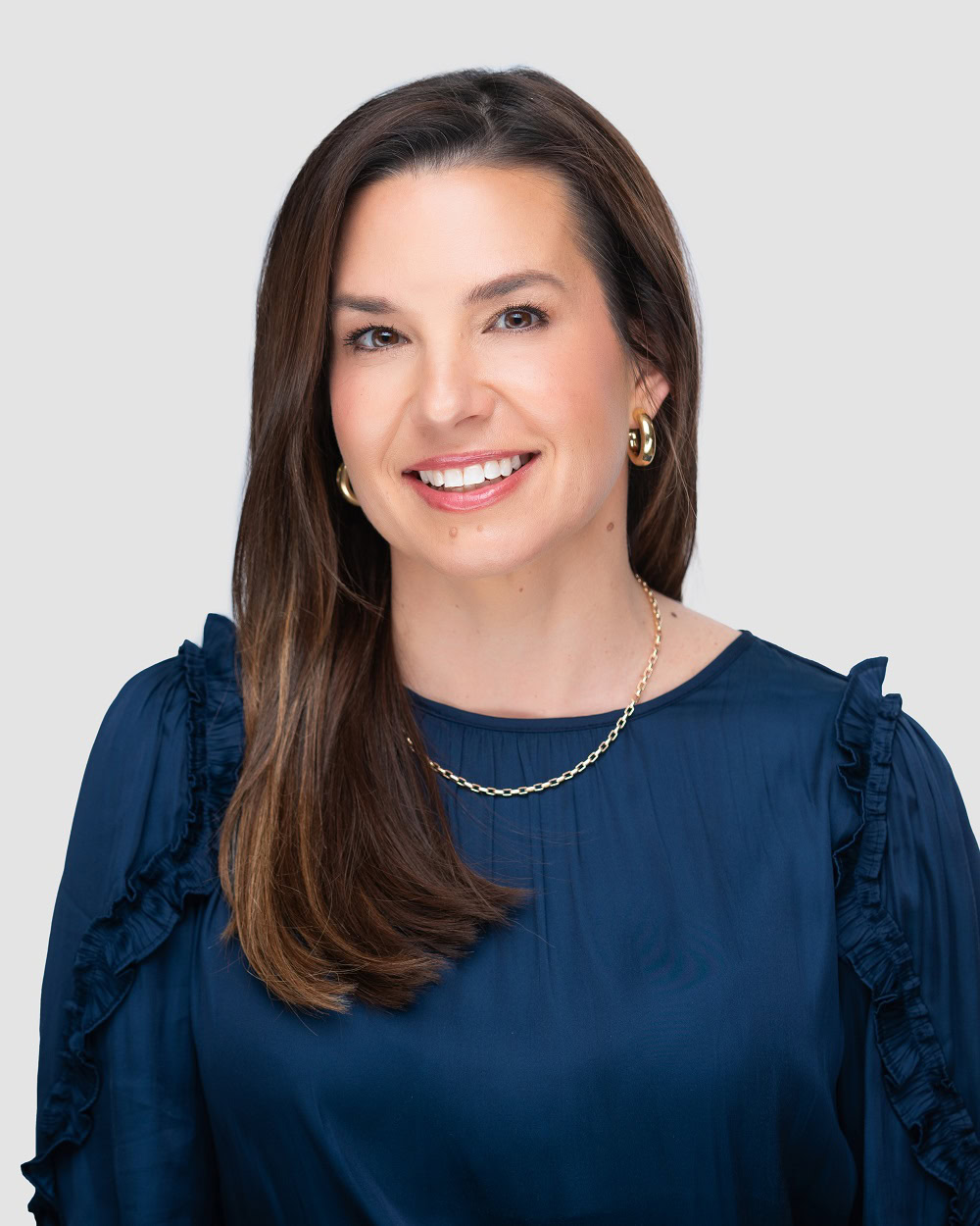 Randi Barrett, Mortgage Loan Officer, smiling in blue blouse.