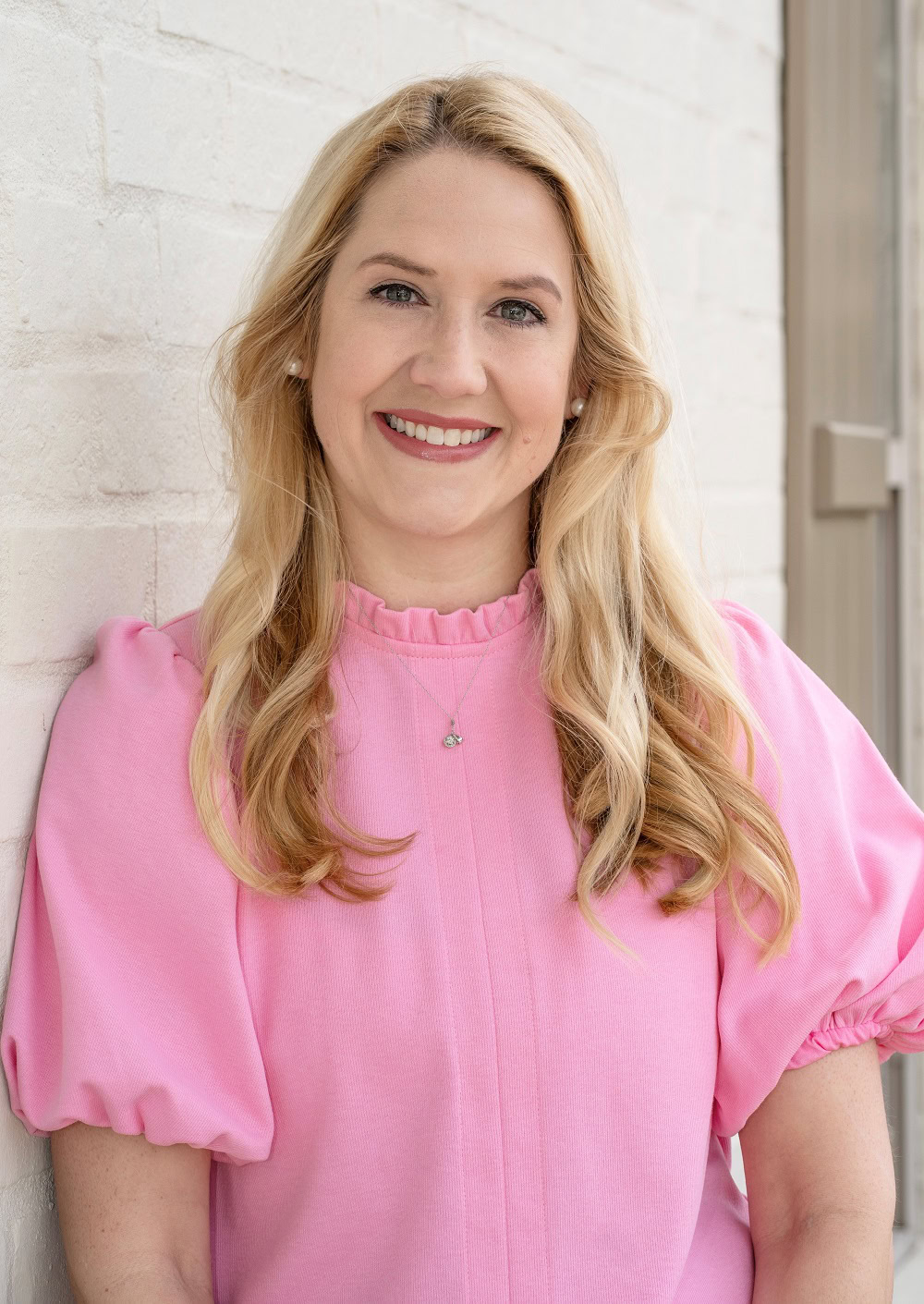 Brandy Boudreaux, Mortgage Loan Officer, smiling in pink blouse.