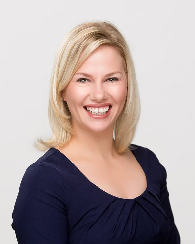 Melissa Brackley, Mortgage Loan Officer, smiling in dark blouse.