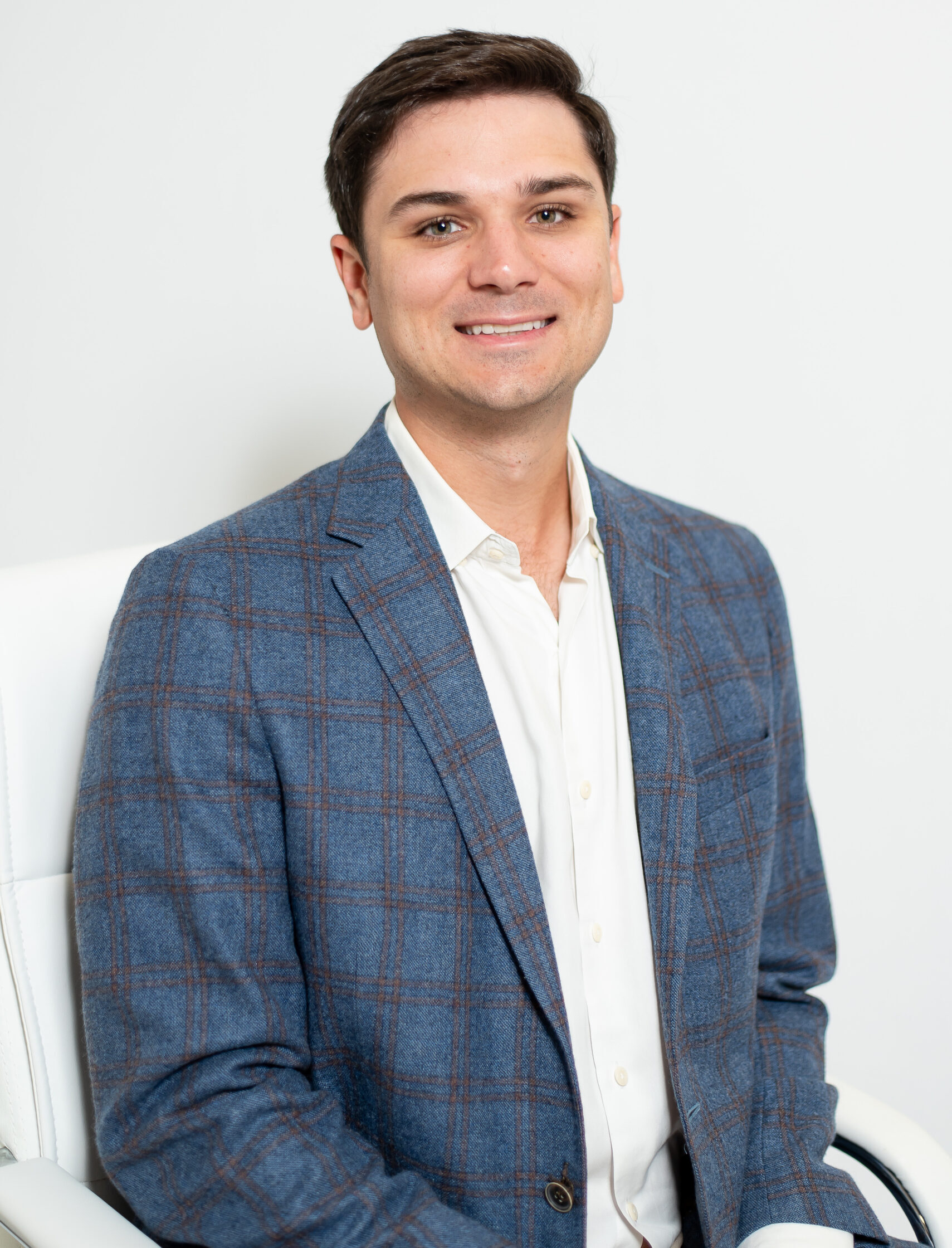 Stinson Lanoix, Mortgage Loan Officer, smiling in blue blazer.